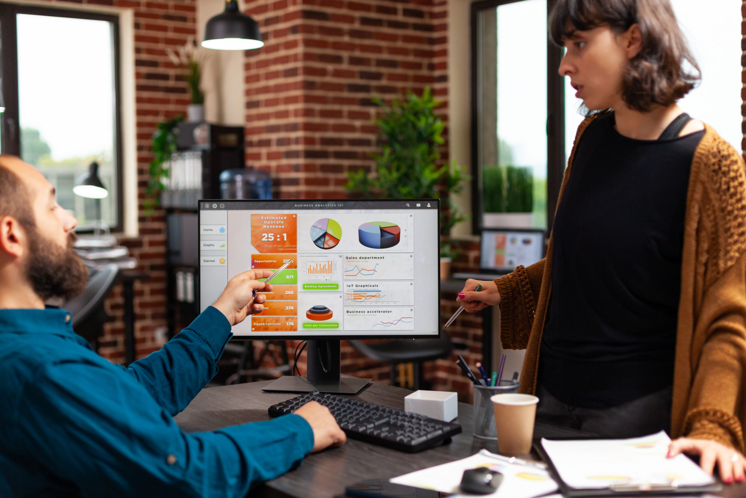 businesspeople discussing management strategy analyzing company data chart